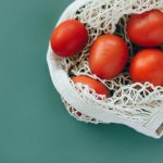 Food waste disposers integrating real compost functionality