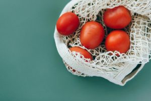 Food waste disposers integrating real compost functionality